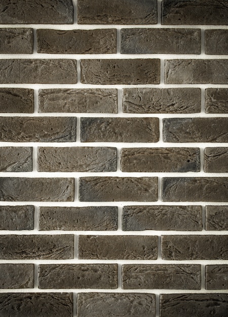 light gray brick wall, creative back-phonon closeup