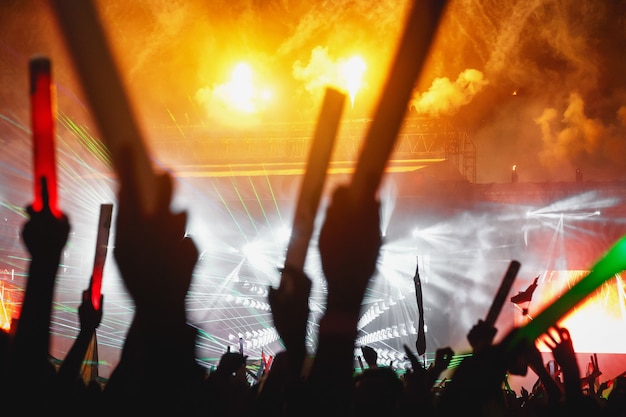 A light show with the crowd pleasure at a summer festival.