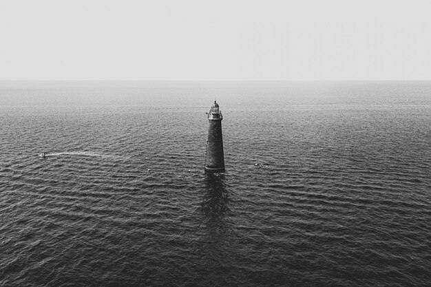 A light tower in the middle of the sea