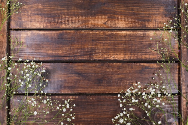 Light white flowers on wood