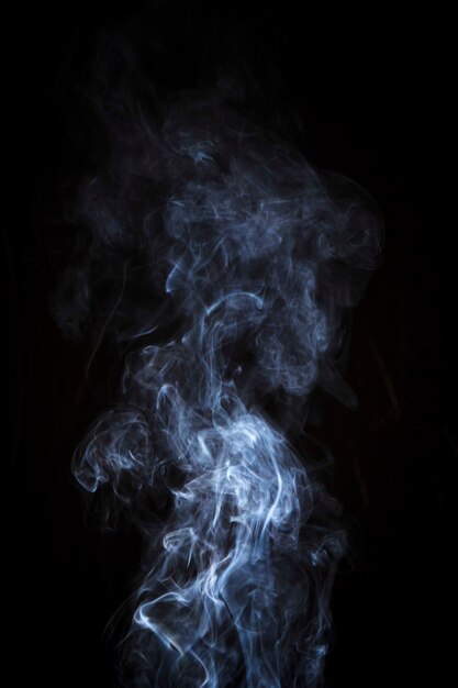 Light white smoke over the black background