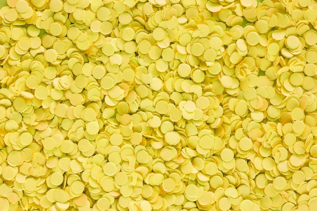 Light yellow confetti from paper