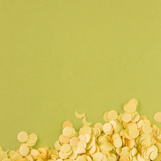 Light yellow confetti on green