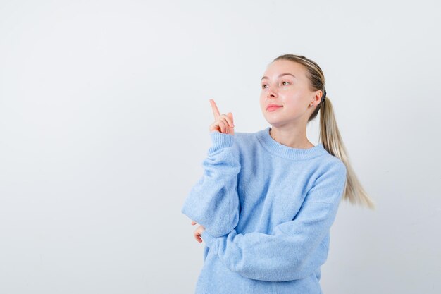 Lightcolored lady is looking something at left on white background