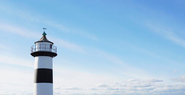 Lighthouse against a blue sky