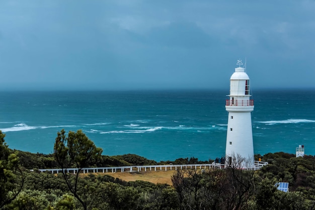 Lighthouse beacon at the coast of the ocean