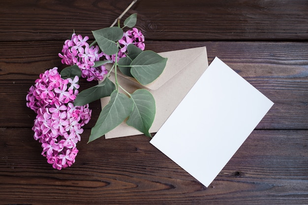 Lilac flowers on wooden table.