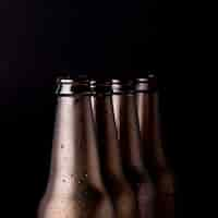 Free photo line of black beer bottles