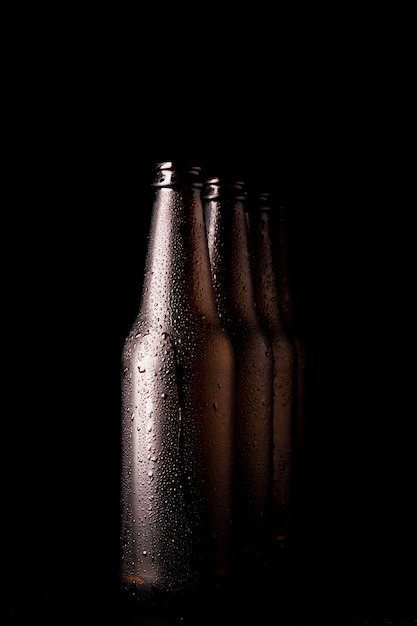 Line of black beer bottles