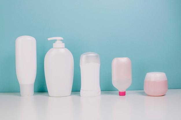 Line of cosmetics bottles and jar