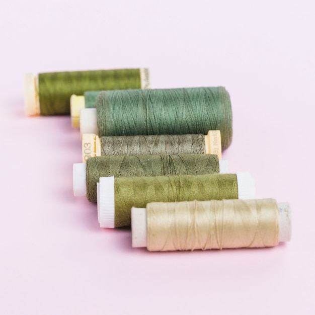 Line of green thread reels