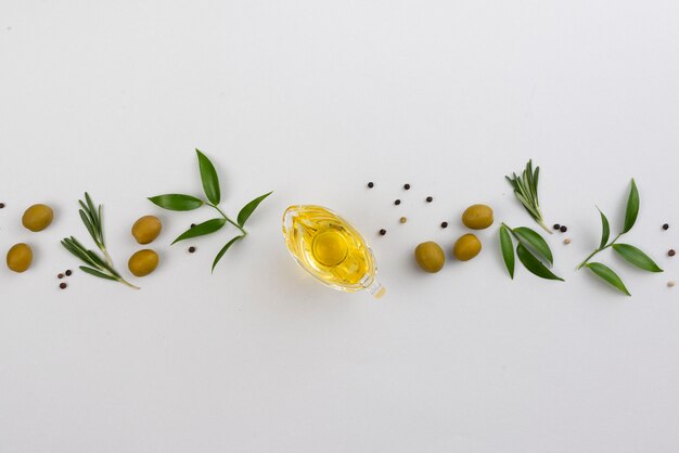 Line made of leaves and olives with oil cup