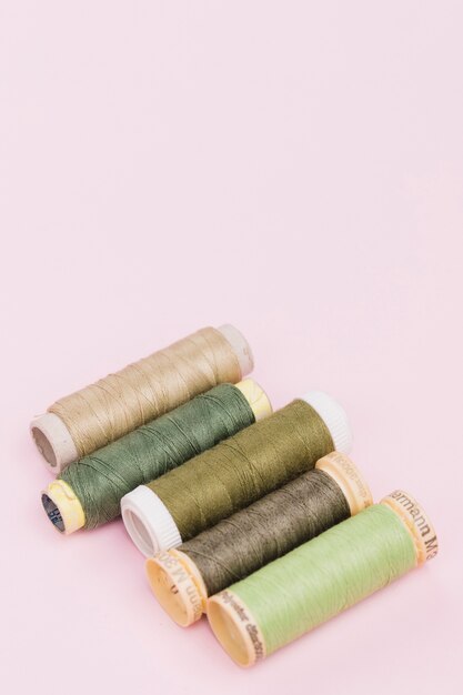 Line of reels of green yarn 