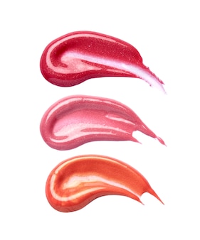 Lip gloss brush strokes in different shades isolated on white