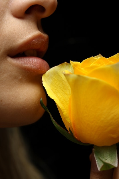 Lips next to a flower