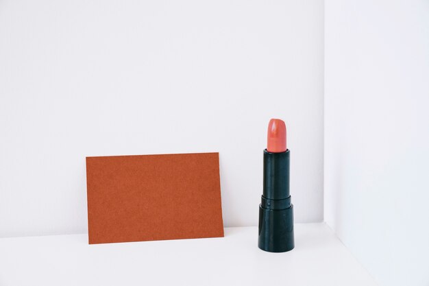 Lipstick next to card