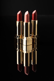 Lipsticks arrangement with dark background