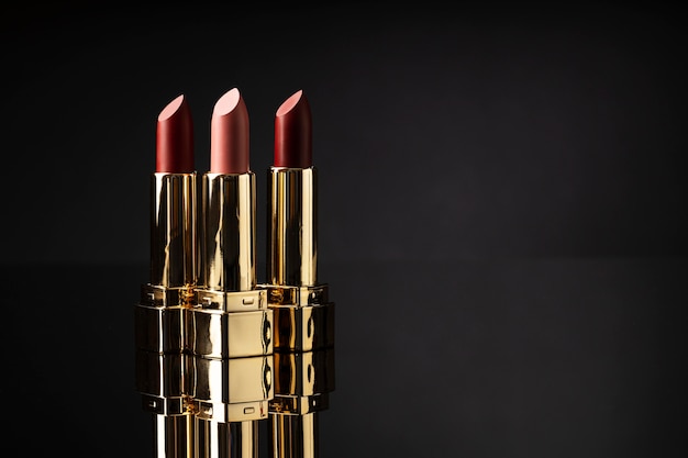 Lipsticks assortment with dark background