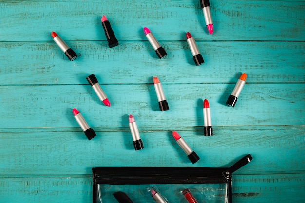 Free photo lipsticks near cosmetics case