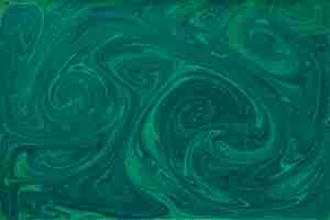 Free photo liquid green and black paint textured marbling backdrop