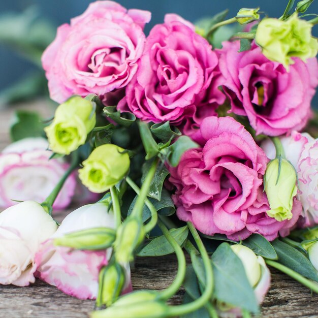 Lisianthus bouquet on a wooden table