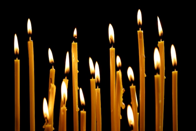 Lit candles with dark background