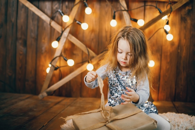 Free photo litle girl opening presents