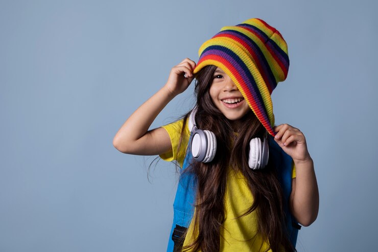 Free Photo little asian school girl with headphones portrait