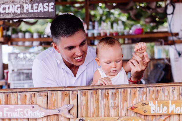 Little baby boy on vacation at bar in Thailand