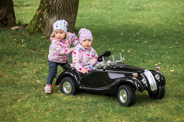 little baby girl playing at car