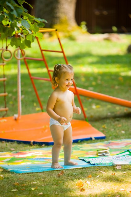 little baby girl playing at outdoor