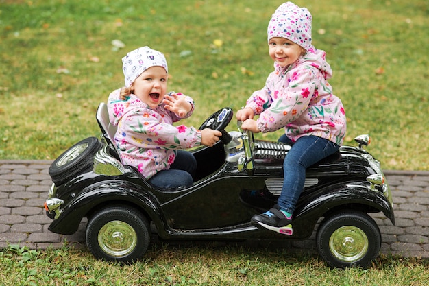 The little baby girls playing with a car