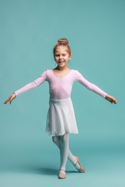 The little balerina dancer on blue space