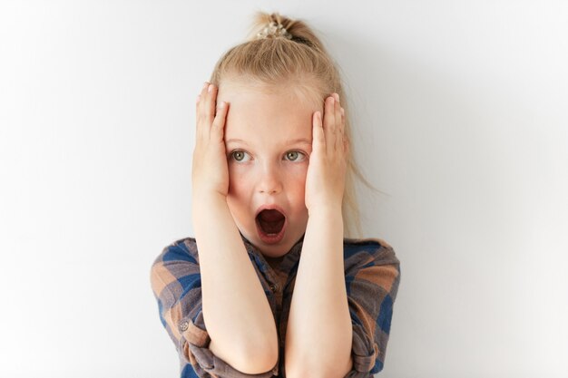 Little blonde girl wearing striped shirt