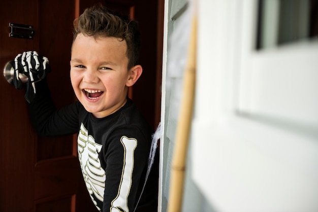 Little boy dressed up as a skelleton