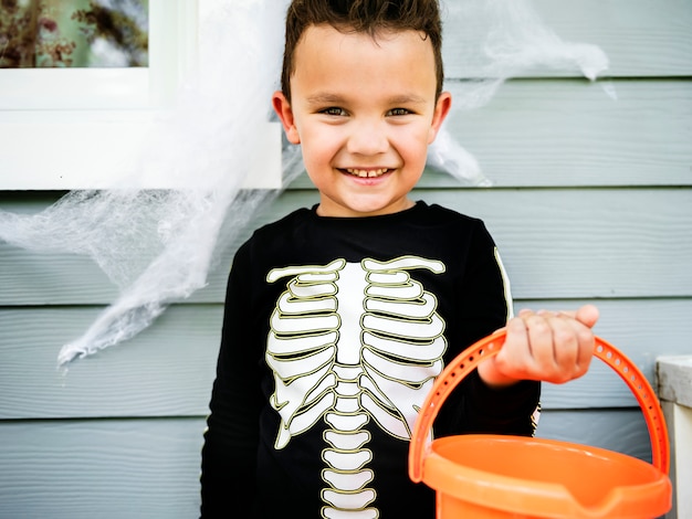 Little boy dressed up as a skelleton