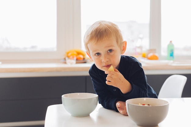 Little boy eating breakfast