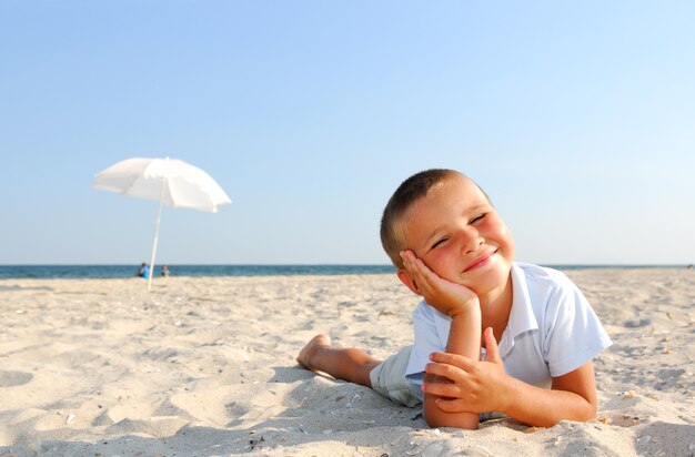 Little boy enjoying on beach