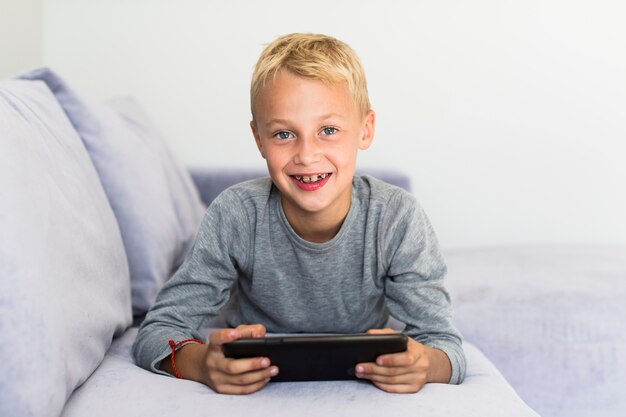 Little boy having fun with tablet