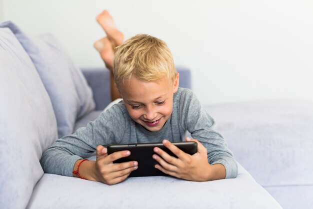 Little boy having fun with tablet