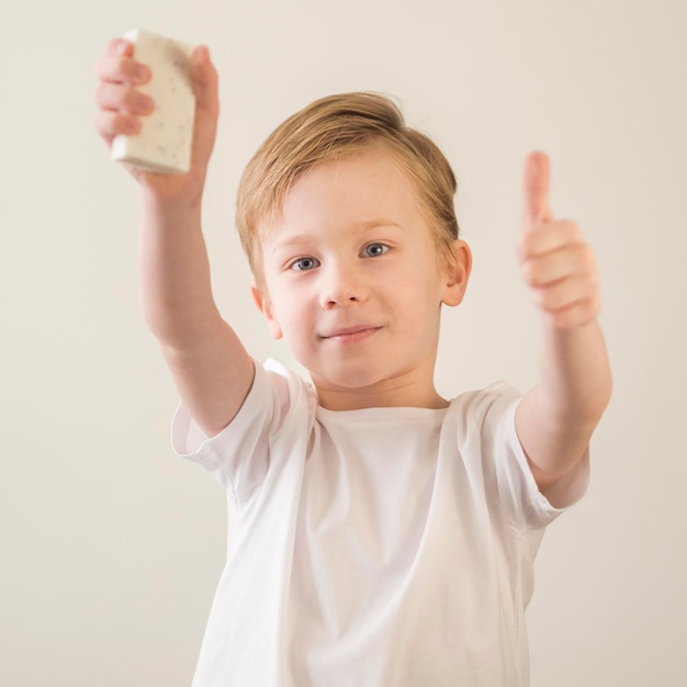 Little boy holding soap