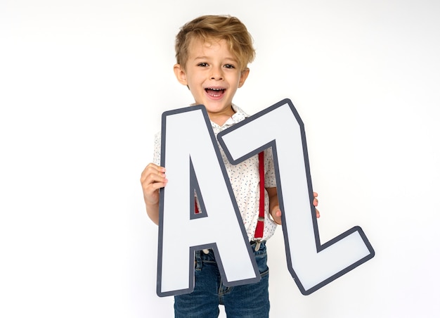 Free photo little boy holding a-z