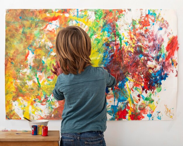 Little boy at home painting