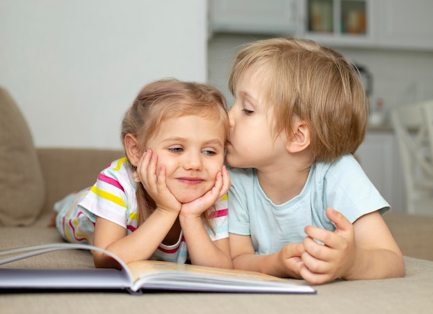 Little boy kissing girl