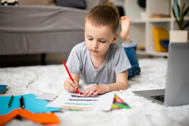 Little boy learning how to draw