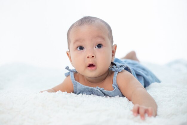 A little boy lying in the bed