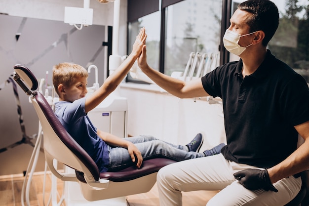 Free photo little boy patient at dentist