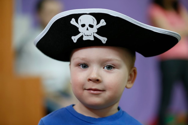 Little boy in a pirate hat.