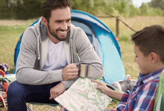 Little boy planning trail for him and his father