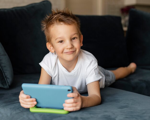 little boy playing on the phone